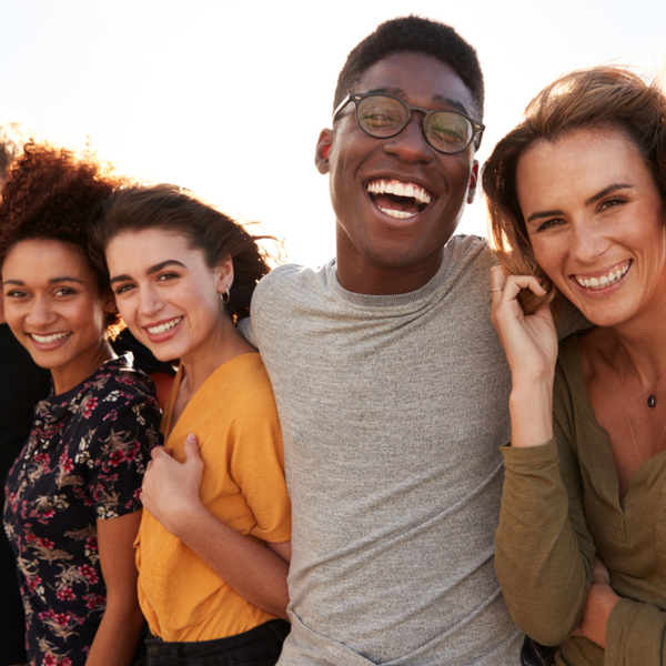 Group of Young Adults Smiling and Laughing Outside